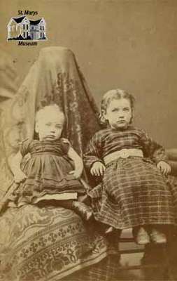 Two young children seated