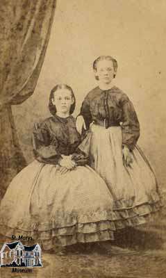 Two girls in full skirts