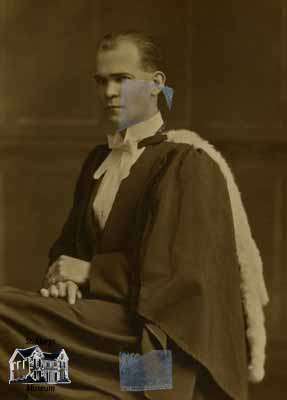 Man in graduation robes and hood