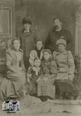 The family of Henry E. Wilson and their dog Duke at Christmas in 1893