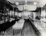Interior of Andrews' store with gas lighting