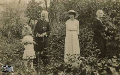 Women and child in garden