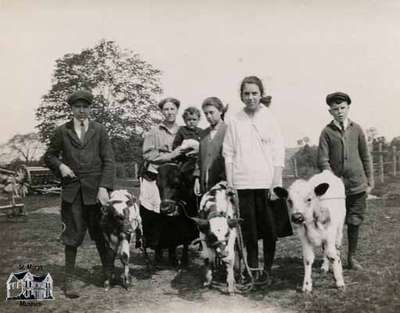 Nettie Fairbairn and the White children with calves