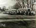 High school students boarding buses