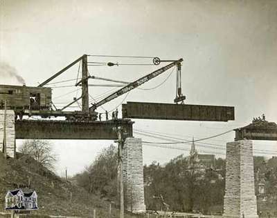 Replacing girders on railway trestle over Trout Creek by CNR station, 1912