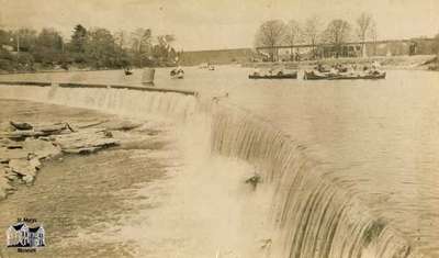 The Falls with canoes on Rice Lake