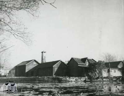 Town barns at confluence of Trout Creek and the Thames River, ca. 1950