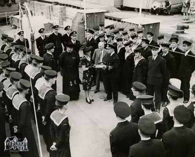 H.M.C.S. Stone Town - receiving the Guest Book