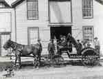 Horse drawn buggy and group of men