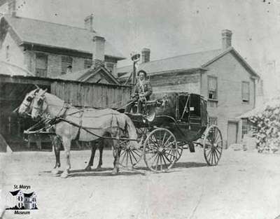 Stage coach behind CPR Hotel (Southeast corner of Water and Jones Streets)