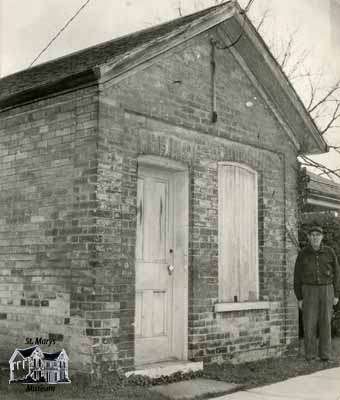 Small brick building located on corner of lot belong to 143 Water Street South