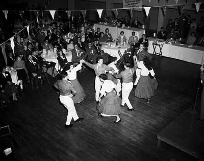 Spectators Look on at Square Dancers, Hamilton, ON