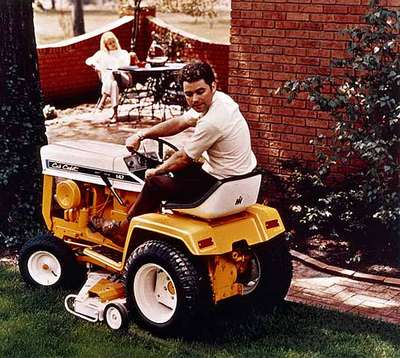 Unidentified Man Mowing the Lawn