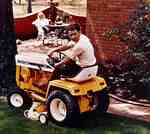 Unidentified Man Mowing the Lawn
