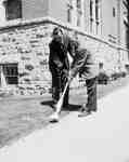 Unidentified Men Using a Weed Trimmer