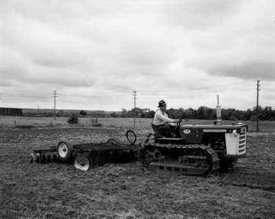 IHC Crawler Tractor, model T5, with disk harrows.