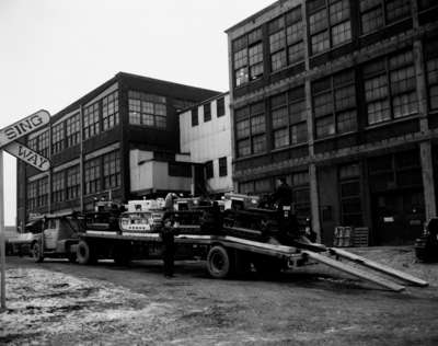 Loading/Unloading Crawler Tractors on an Auto Haulaway Truck.