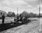 Planting seeds in St. Agatha, Ontario, with an IHC tractor and seed drill.