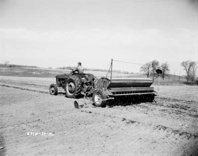 Seed planting in St. Agatha, Ontario, using an IHC 300 tractor, and an IHC McCormick 16 x 7 seed drill.