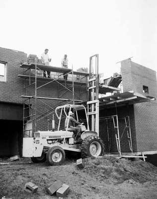 An IHC 4421 Forklift lifting bricks in the construction of a house in Burlington, Ontario.