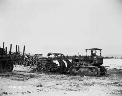 An IHC Crawler tractor, model TD 14, with a Drott Log Loader attached, in Rouyn, Quebec.