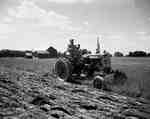 Ploughing with an IHC McCormick Farmall 230 tractor and an economy plough.