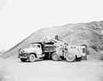 Road construction with an IHC W400 tractor, and an IHC truck,owned by Atlas Construction Co., Gagetown, New Brunswick.