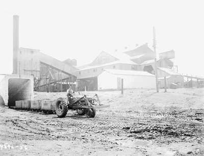 Coal mining in Amherst, Nova Scotia, with an IHC Farmall 300 tractor.