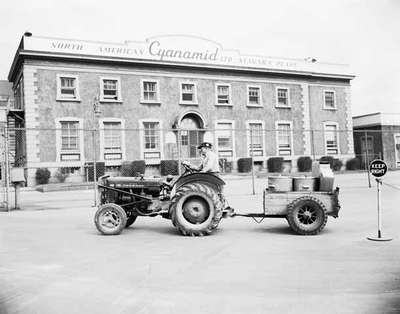 An IHC McCormick Farmall 100 tractor converted for industrial use at the Niagara plant of North American Cyanamid Ltd.