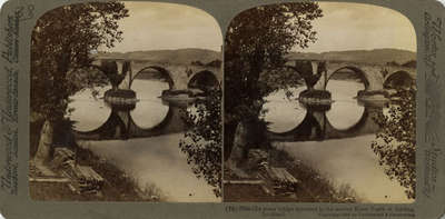 Old stone bridge mirrored in the storied River Forth at Stirling, Scotland