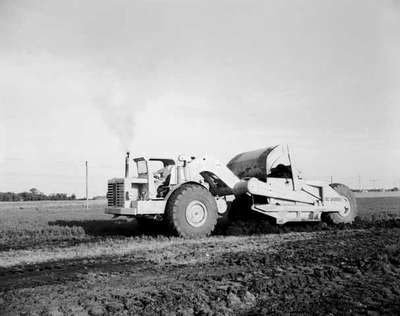 Fast Brothers Ltd. clearing the land with an IHC Scraper model 295.