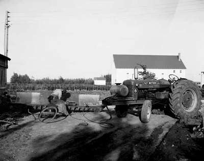 The Fast Brothers Ltd. welding a tractor mounted shovel or dozer blade.