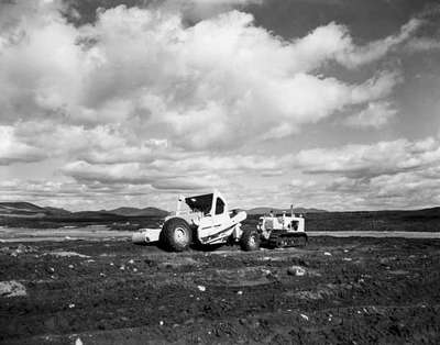 Road construction using an IHC TD25 crawler tractor and an IHC 45-85 scraper near Murray's Bay, Quebec.