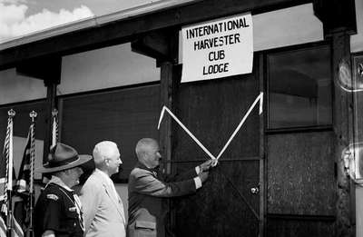 The ribbon cutting ceremony of the International Harvester Club Lodge, Mount Nemo, Ontario, scouting grounds.