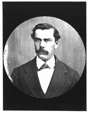 Portrait of a young man with moustache.