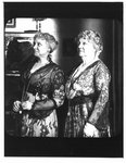 Elizabeth Corey (left) and Margaret Griffin (right) in the parlour of the Wellington County House of Industry and Refuge in Aboyne, Ontario, ca. 1915 (3/4 length)