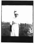 Portrait of woman standing in a field.