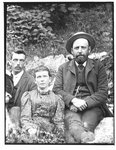 Outdoor portrait of two men and a woman.