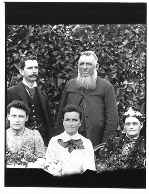 Outdoors group portrait of two men and three women.