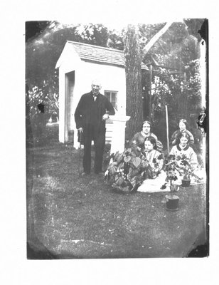 Portrait of Andrew Geddes and family, of Elora, in their back garden.