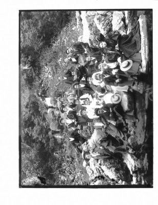 Portrait of a group of young men and women on an Elora river bank.