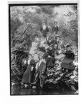 Portrait of a group of young men and women on an Elora river bank.