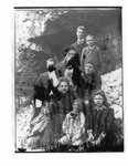 Portrait of a family, on a rocky river bank