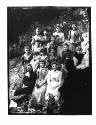 Group portrait of unidentified women on a rocky Elora river bank.