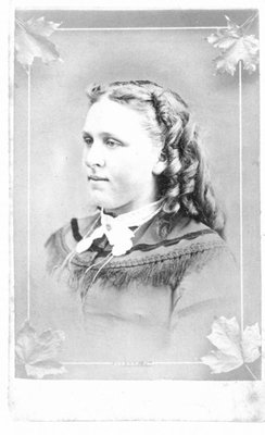 Portrait of a young woman with ringlets.