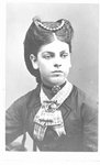 Portrait of an unidentified young woman with an elaborate hairstyle.