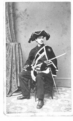 Portrait of an unidentified, uniformed man, seated.