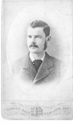 Bust portrait of an unidentified young man with moustache and sideburns, by Farmer Brothers, photographers, Hamilton, Ontario.