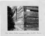 The dovetailed corner of Captain Smith's house, made of squared logs.