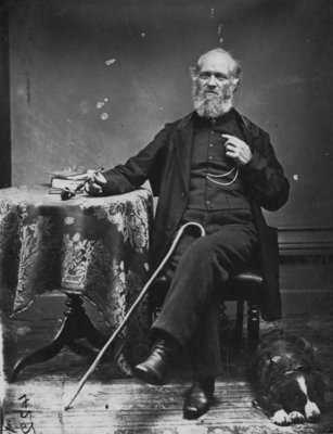 Portrait of an unidentified man, seated, with his dog.